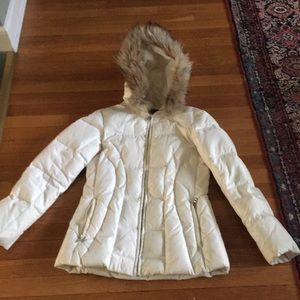 White winter parka with fur trimmed hood,